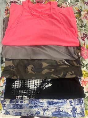Five (5) men’s Performance Tank Tops
